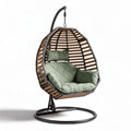 Poltrona sospesa in rattan con cuscino verde dimensioni 100 x 75 x 120cm